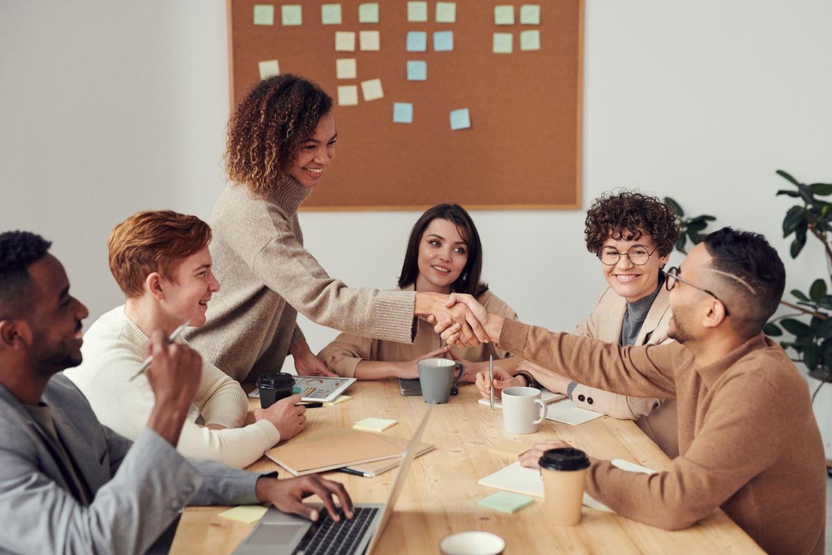 Colleagues discussing a project around a table