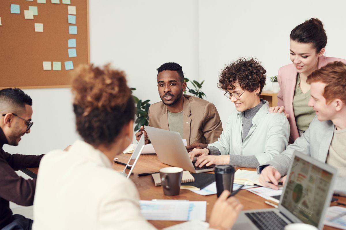A team meeting around a desk