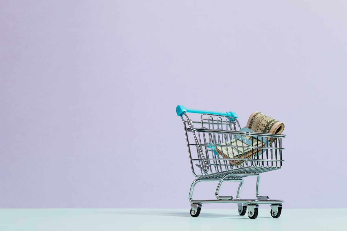 A small shopping trolley on a plain background