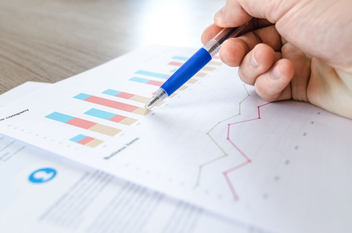 Printed charts being reviewed with a pen